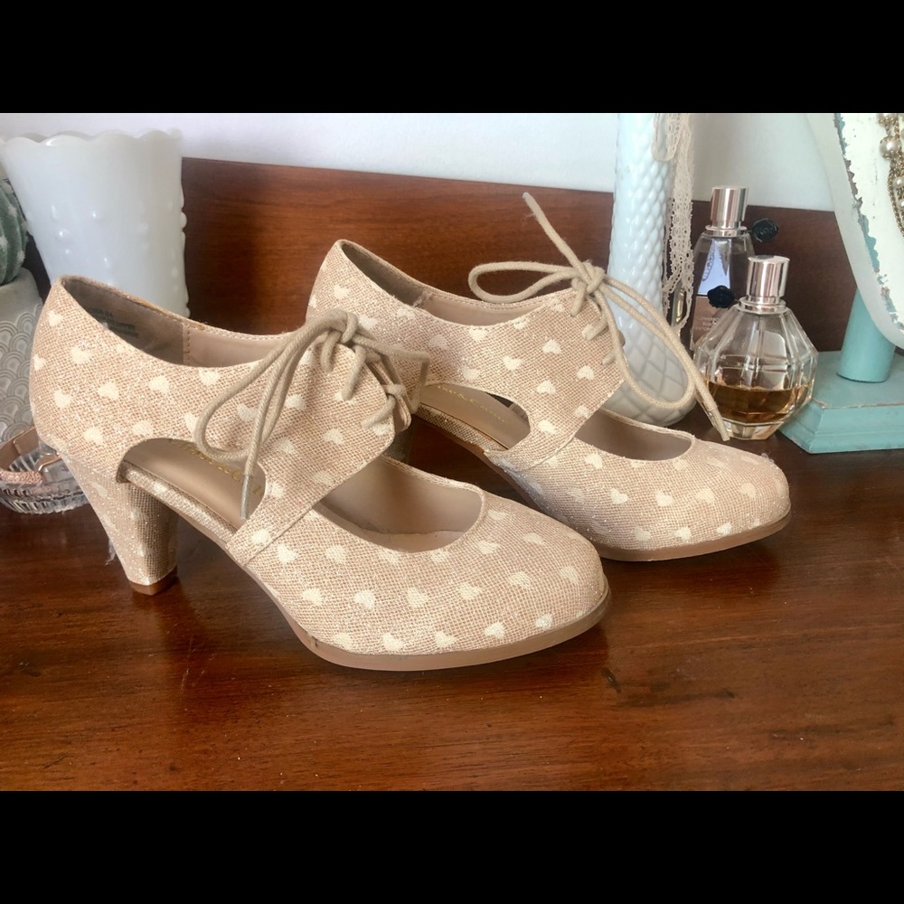 New heart print gold swing heels